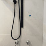 Mismatched shower and tapware Shower head and tapware not the same colour